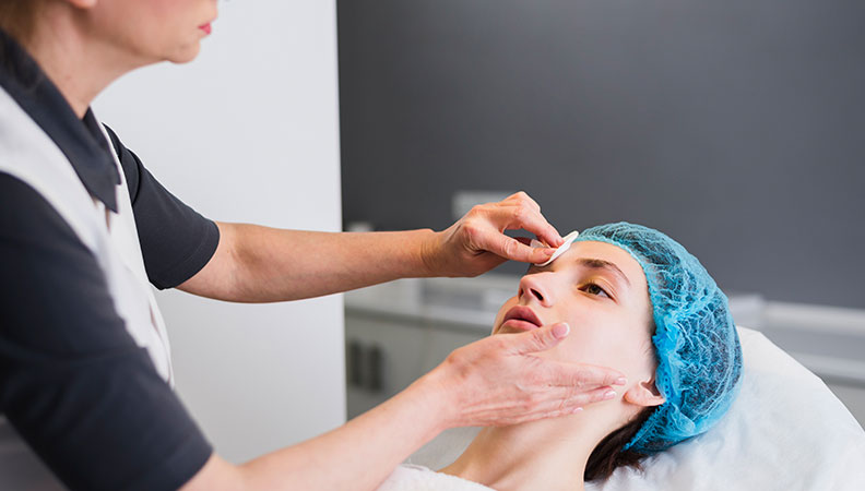 Closeup of a person's skin showing acne, with text overlay for "Acne Treatments" page.